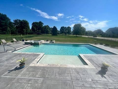 geometric, gunite pool with tanning ledge and raised spa