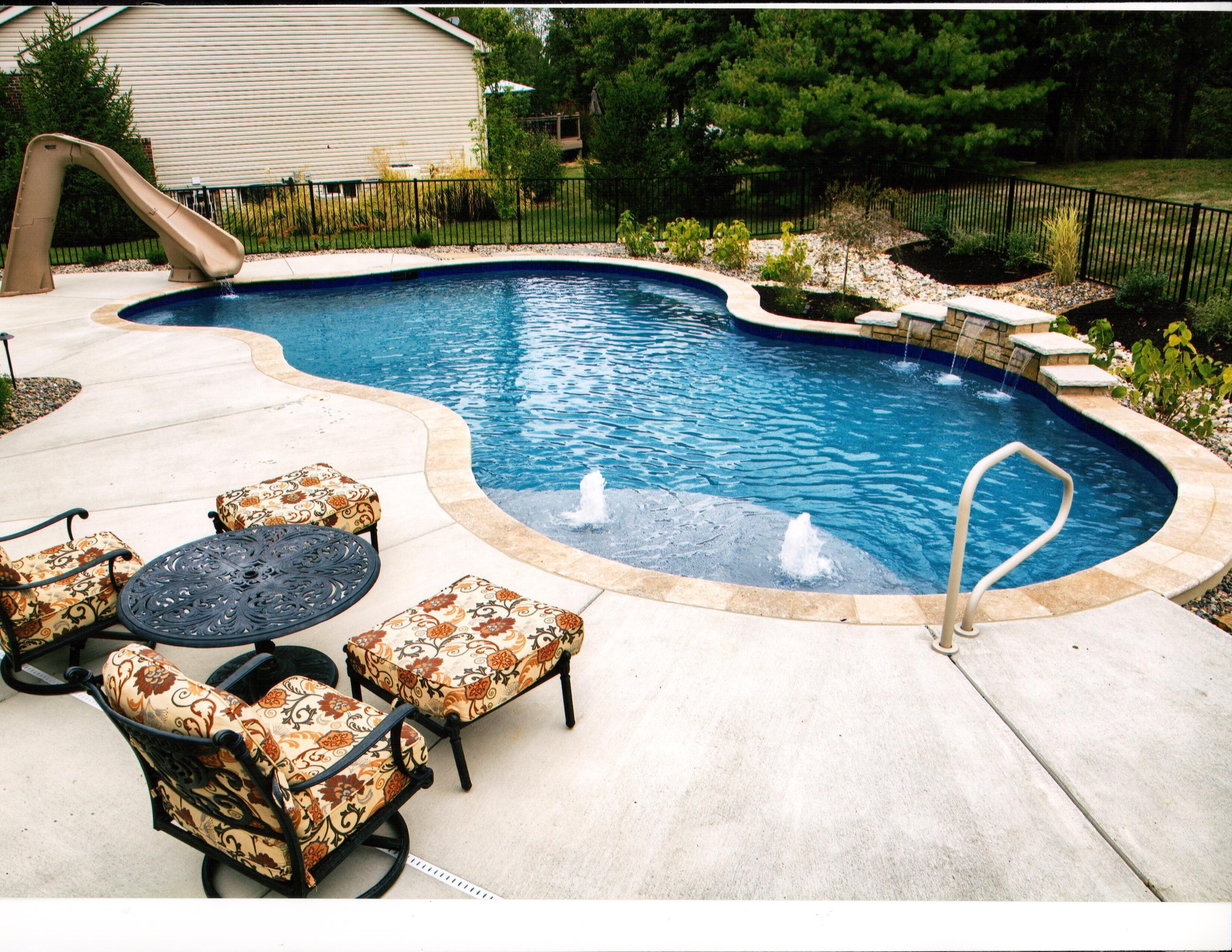 freeform, gunite pool with bubblers, slide, and tiered sheers
