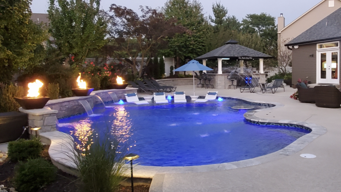 freeform, gunite pool woth fire bowls, sheers, taning ledge, and bubblers